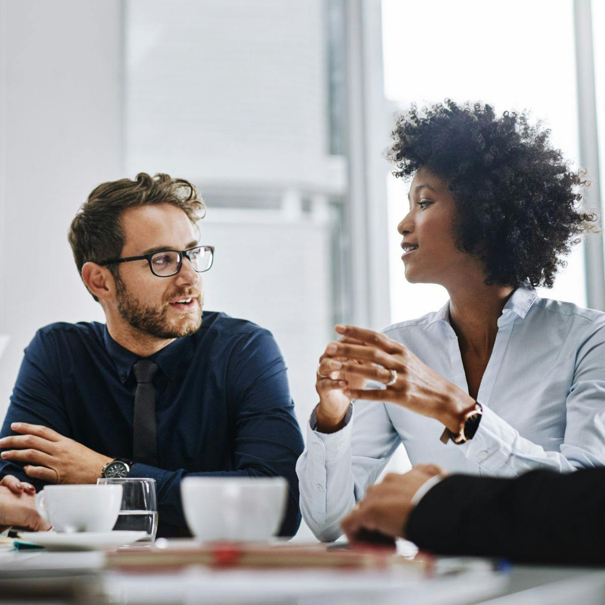 Man and woman having a discussion in office